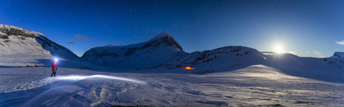 Person with tent on full moon in the snow, Kungsleden or king's trail, Province of Lapland, Sweden, Scandinavia, Europe