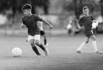 Foto op Aluminium Young children players football match on soccer field © Dusan Kostic