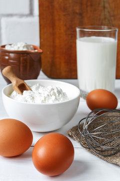 eggs milk flour and various ingredients for cooking in rustic style with copy space