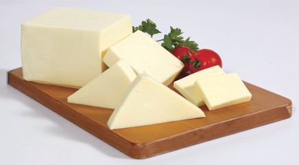 cheese on wooden board isolated on white
