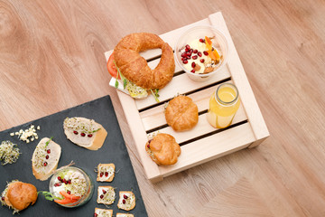 Healthy food, menu with microgreens. Vegetarian sandwiches with micro greens assortment. Vegan party food table with organic vegetables canapes. Healthy lifestyle and eating right concept, top view.