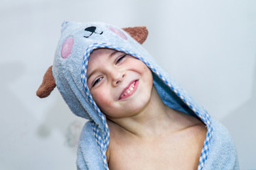 Obraz premium The boy in the towel, after the bath.