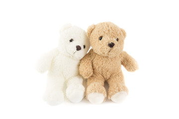 Two lover of white and brown fluffy cute romantic teddy bear cuddle together with white background.