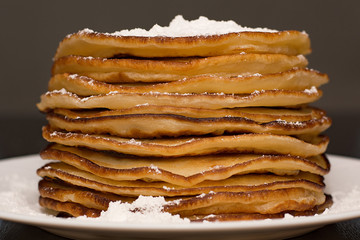Pancakes in powdered sugar.