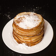 Pancakes in powdered sugar.