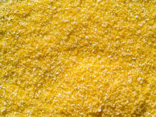 raw dry grains polenta, close-up, top view