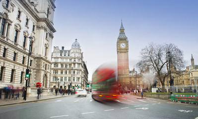 London city scene with red bus and Big Ben in background. Long exposure photo