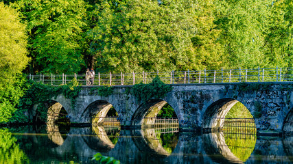 Belgium, Brugge  Minnewater Bridge, Lago Minnewater  Seven-arch arch bridge of brick and bluestone,...