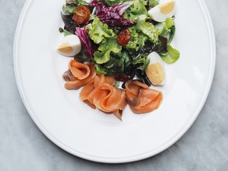 Close up delicious dish of salad on table.