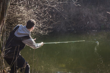 The fisherman throws a hook