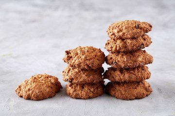 Sweet biscuits arranged in pattern on light textured background, close-up, shallow depth of field, selective focus.