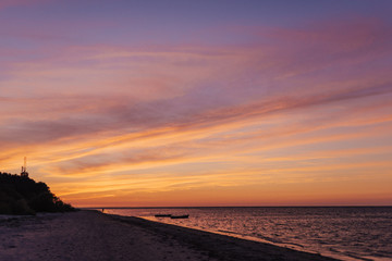 Fototapeta na wymiar Colorful cloudscape after sunset on the beach. Latvia