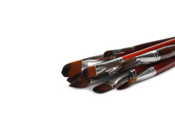 close up brushes painting isolated on white
