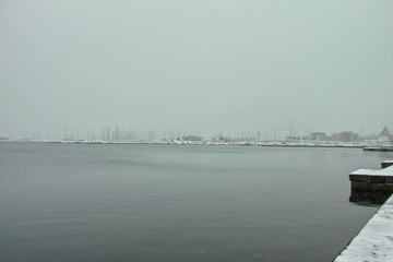 storm of snow in the harbour of la spezia