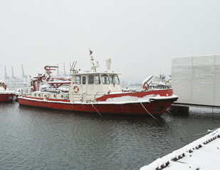Fototapeta premium detail of fireboat covered by snow