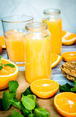 healthy morning with orange juice in bottle on kitchen backgroun