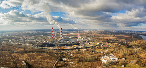 Aerial view of power plant under cloudy sky, Warsaw
