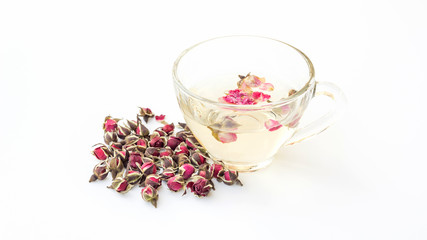 A cup of tea pink rose on a white background.