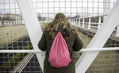 Woman leaning bridge