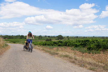 Woman riding with a toddler