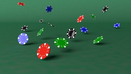 Poker chips falling down on a green table