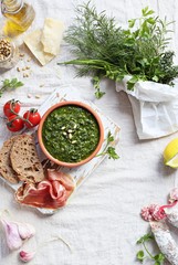 Pesto and ingredients for making of traditional italian pesto dip. Overhead view