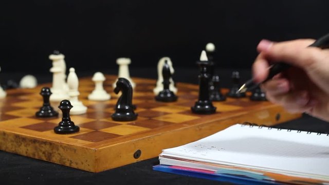 Game of chess. Friends in the competition play chess. World Chess Tournament. Victory and defeat. Checkmate. Bracing. King and Queen.
