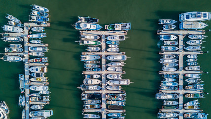 Aerial view Yacht parking, A marina lot, Yacht and sailboat is moored at the quay, Aerial view by drone.