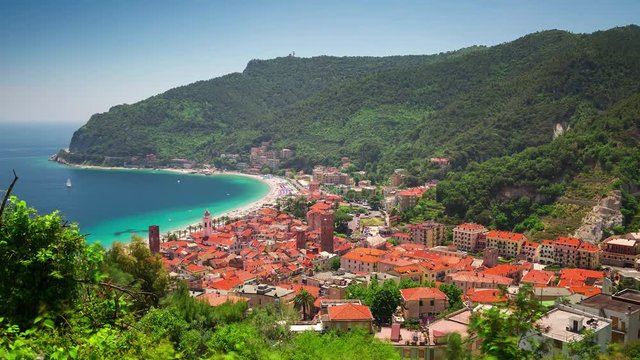 NOLI, ITALY - MAY 3, 2017: Timelapse of Liguria coast. Blue sky, blue sea. Clouds moving.