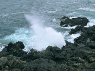 Saint Leu / La Reunion: Le Souffleur is a natural phenomenon on the wild rocky coast caused by the repeated onslaught of the sea swell with an impressive jet of sea-spray