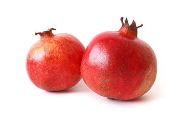 Two ripe pomegranate isolated on white background. Healthy food.