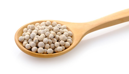 Pepper seeds in wooden spoon