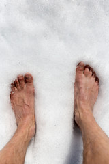 Fototapeta premium pieds dans la neige