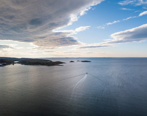 Drone Photography of a Boat Sailing into Fjord in Norway