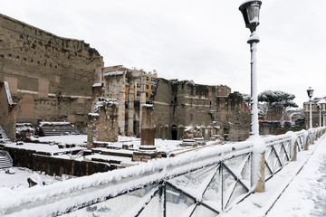 Snow covers the streets of Rome, Italy. Imperial forum.