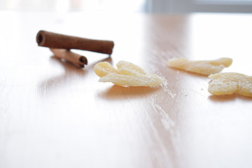 Dried ginger and cinnamon sticks on the table.