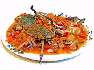 Spicy papaya salad with horse crab on white background