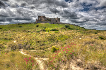 Fototapeta na wymiar Bamburgh castle on a hill Northumberland north east England UK in hdr