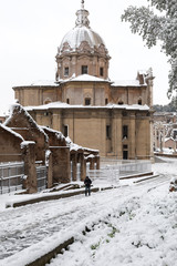 Snow covers the streets of Rome, Italy. Ancient Roman road, Clivus Argentarius