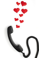 retro telephone handset with hearts isolated on white