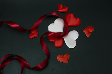 ribbon with hearts on a black background