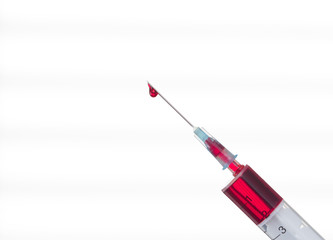 Syringe with a drop of blood on a needle on a white background - 194600697