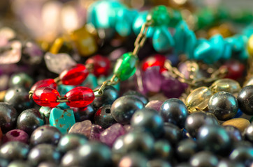 Close up of colorful bracelets and pearls