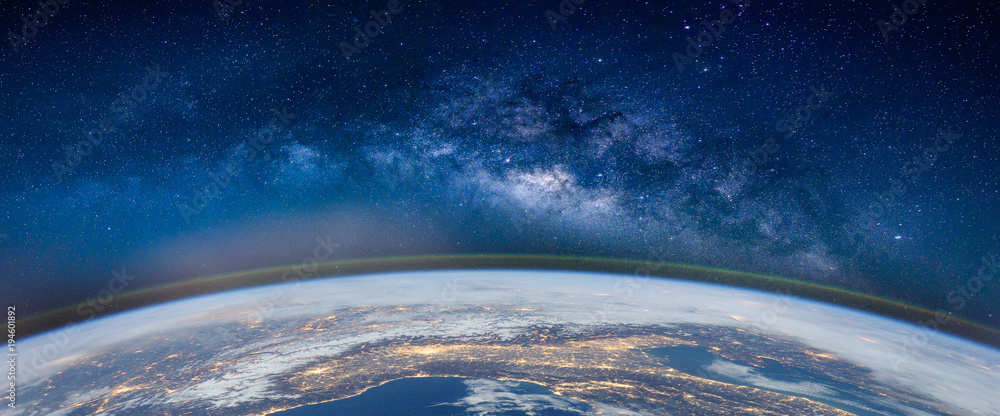 Wall mural landscape with milky way galaxy. earth and aurora view from space with milky way galaxy. (elements o