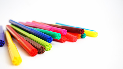 multi-colored felt-tip pens on the white isolated background, 18 colors.