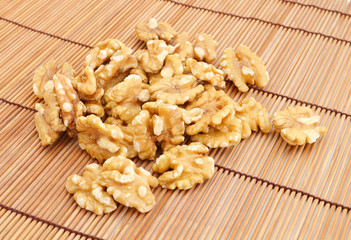 walnut on bamboo mat background