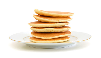 A stack of plain pancakes in plate on a white background.