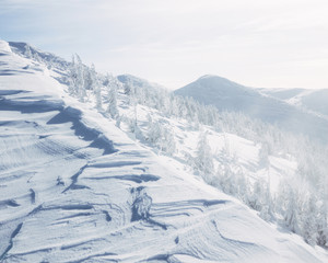 Fototapeta na wymiar Tranquil snowy mountains landscape of Gorgany mountains