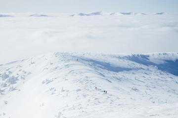 Aerial view of climbers team in snowy Gorgany mountains
