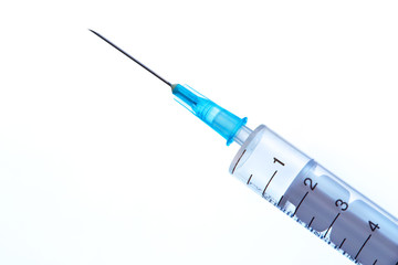 Medical syringe with a needle on a white background
